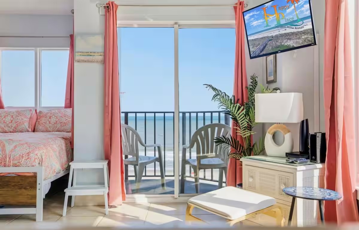 Interior of the luxury oceanfront studio in Myrtle Beach looking out to the private balcony